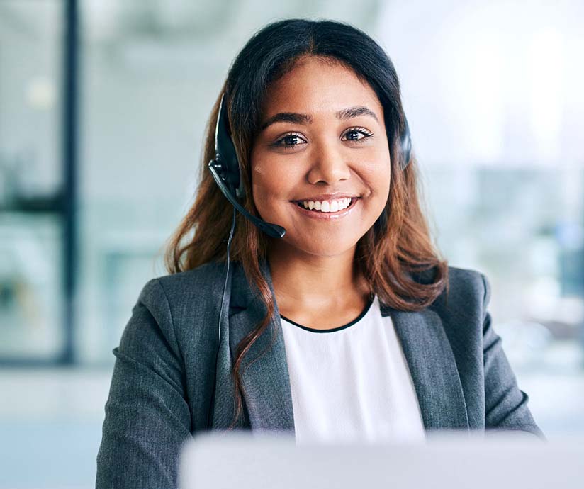 women on computer and headset