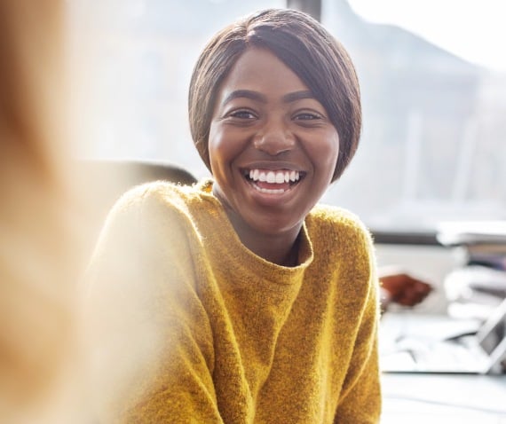 Woman in conversation laughing