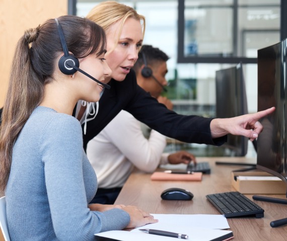 two women talking over computer screen