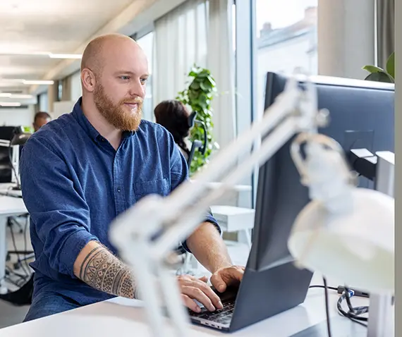 Man typing on a computer