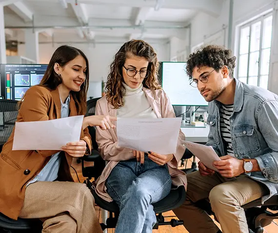 three co-workers in a discussion