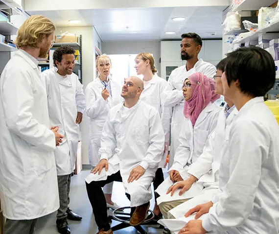 people in white coats meeting