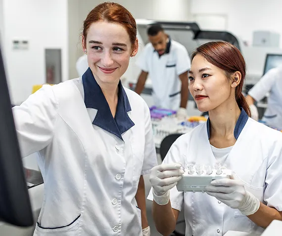 two women in lab coats