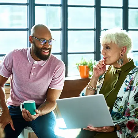 man and women in discussion at work