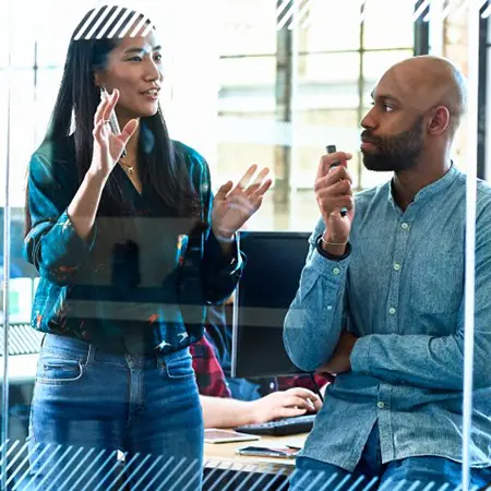 man and women in discussion at work