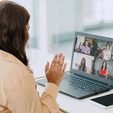 women in a virtual meeting on laptop